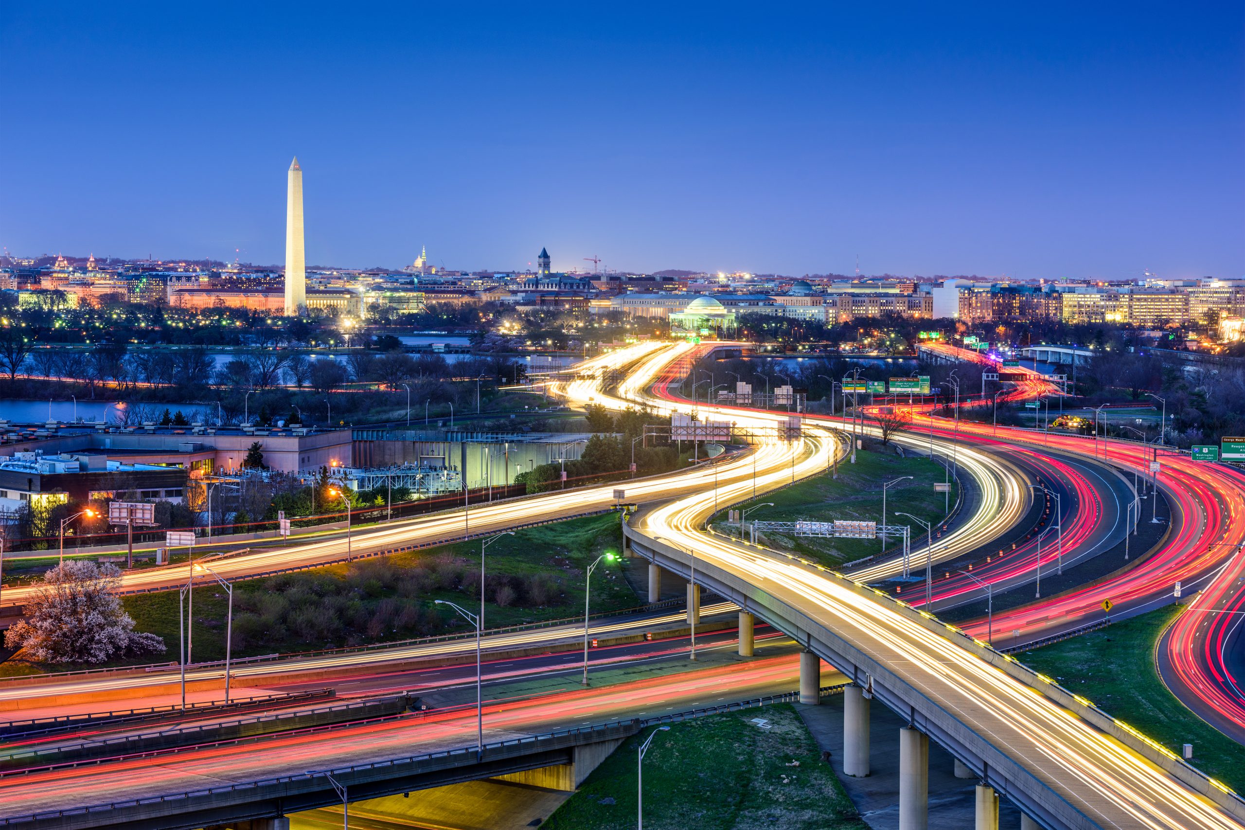 Washington, DC skyline with highways and monuments.
