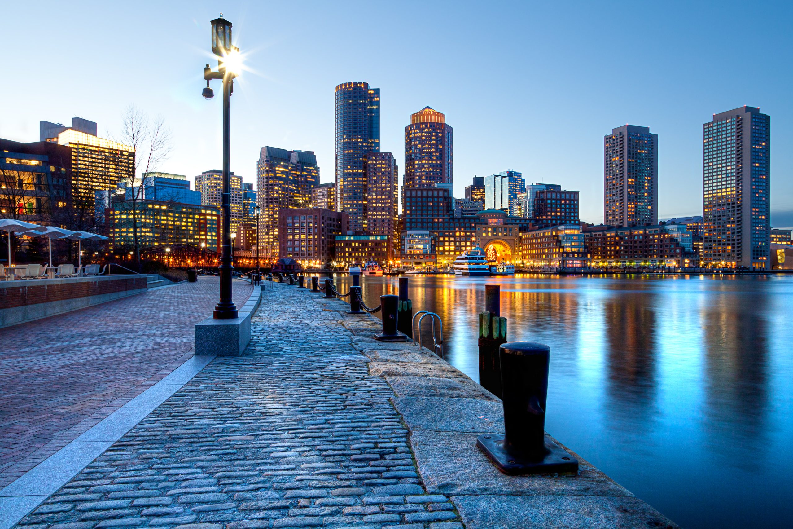 Boston harbor and financial district at sunset in Boston, Massachusetts.
